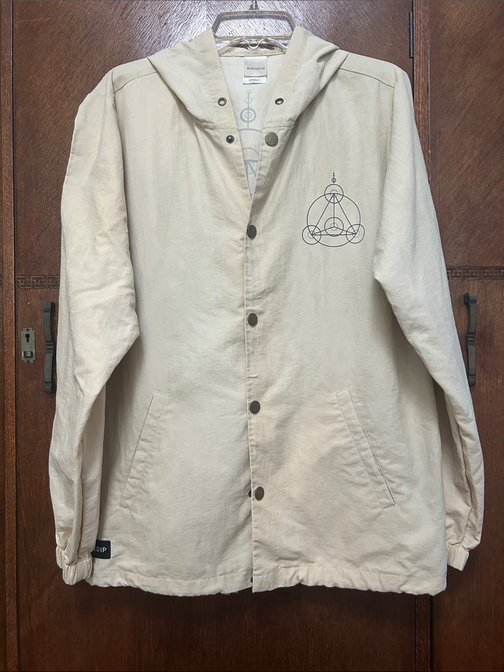 Ripndip Cream Hooded Coach Jacket with Minimal Chest Graphic
